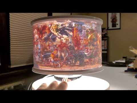 I 3D printed a colored lampshade lithophane of the final Smash Bros Ultimate character mural. Took 4 days 21 hours to print. I think it turned out pretty great!