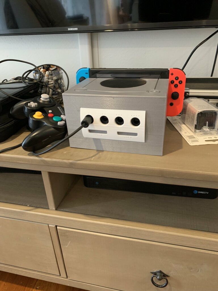 I made a Switch Dock cover that fits the GC controller adapter