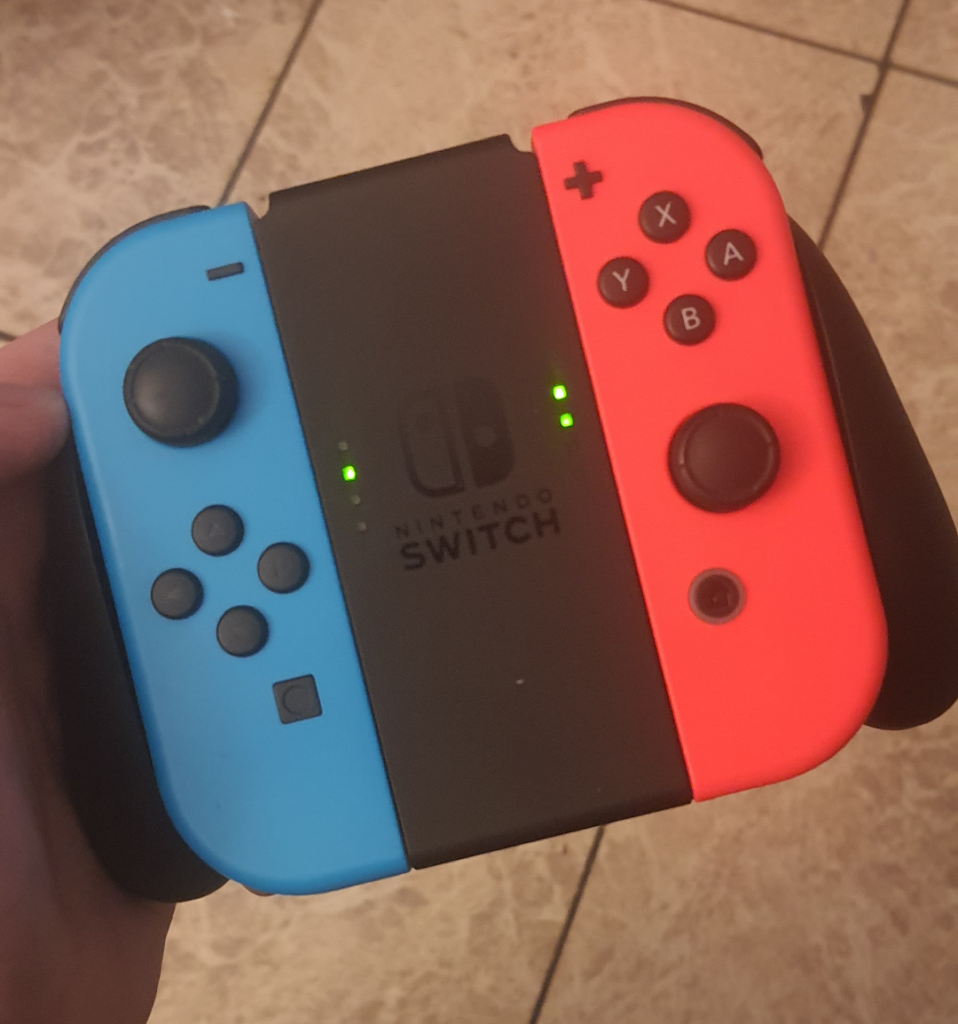 I need help! As soon as I put the Joy cons in this to play on the big screen they don't connect anymore