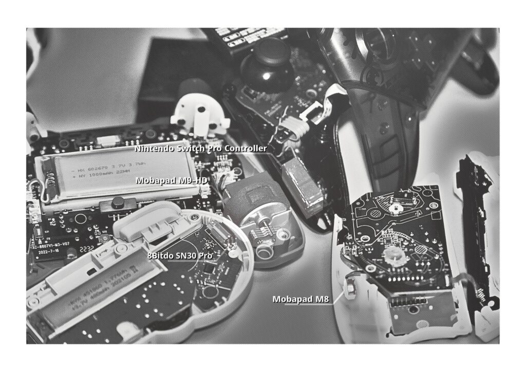 Different Nintendo Switch controller rumble motor sizes (8bitdo SN30 pro, Mobapad M8, Mobapad M9-HD, Nintendo Switch Pro controller). Showcased in a photo that I took after (slightly) dismantling my Switch controllers.