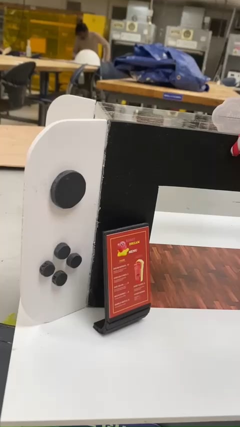 I made a mini model of a Nintendo cafe to promote Kirby's dream buffet game for a school project!