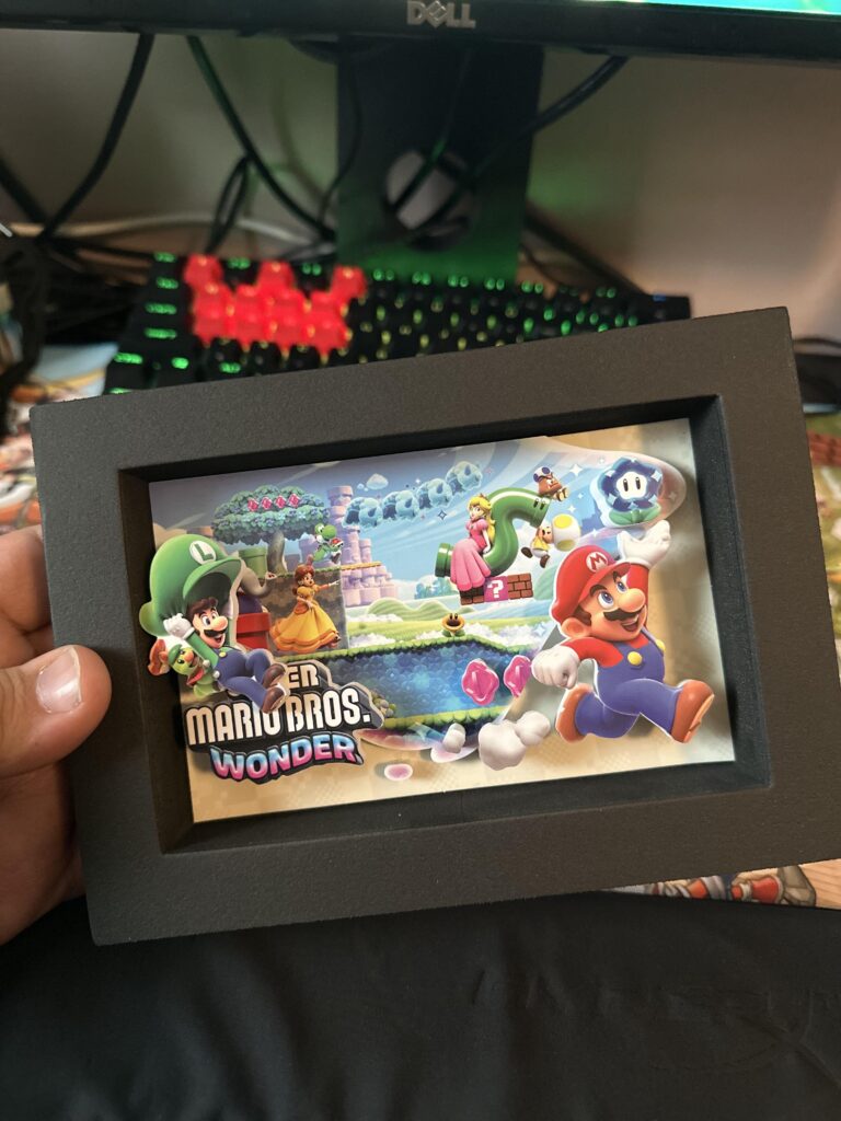 For anyone curious the Shadowbox from Target is made of foam not plastic.... I LOVE IT.