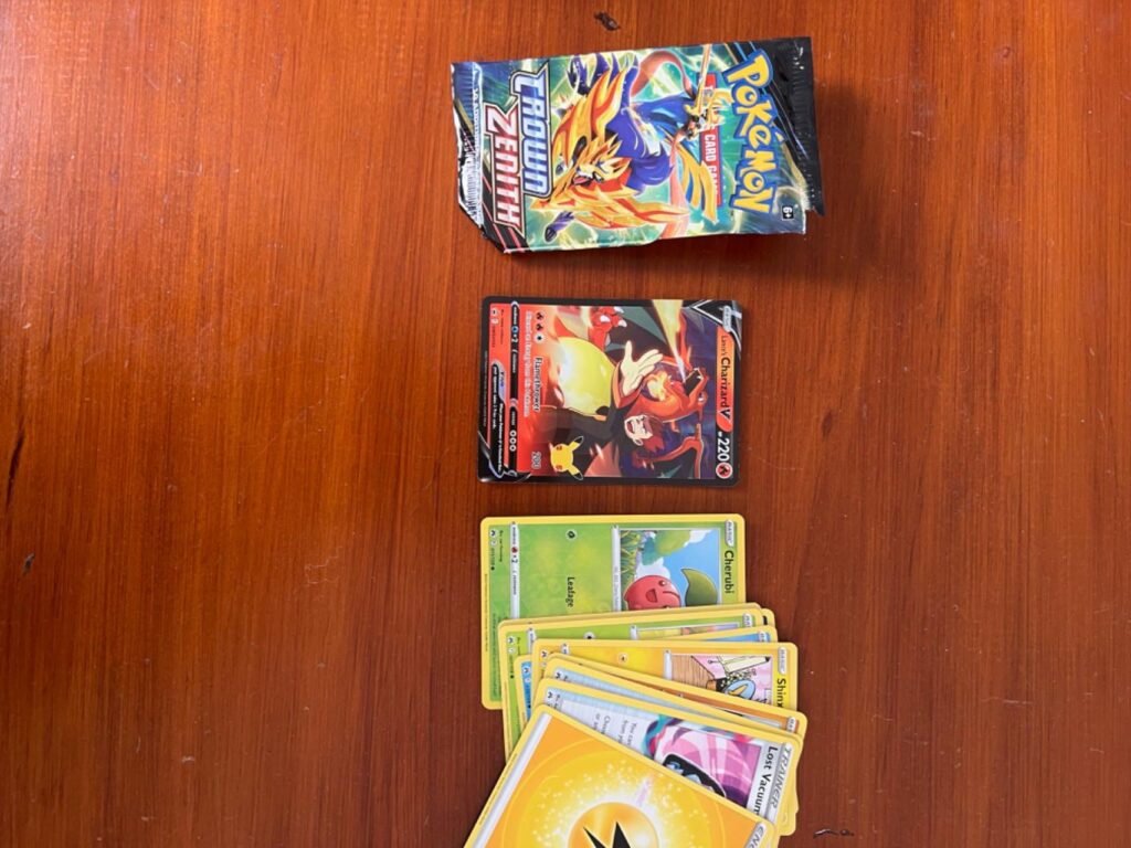 WTF??? Opened a crown zenith etb and got a Lance's Charizard V Promo???