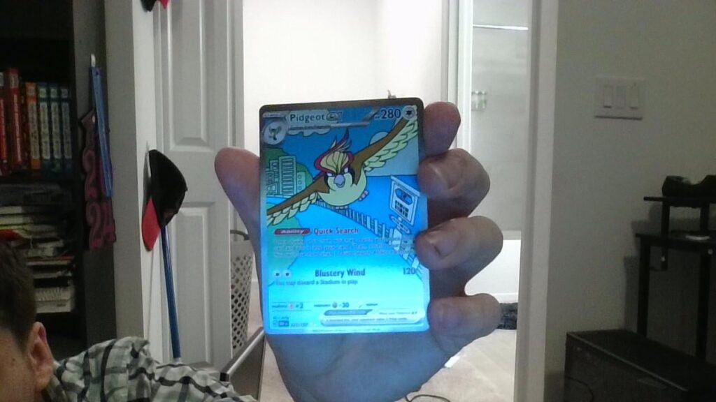 Does this card look damaged? I accidently got tape on the top right corner and I pulled it off but I don't know if theres any damage.