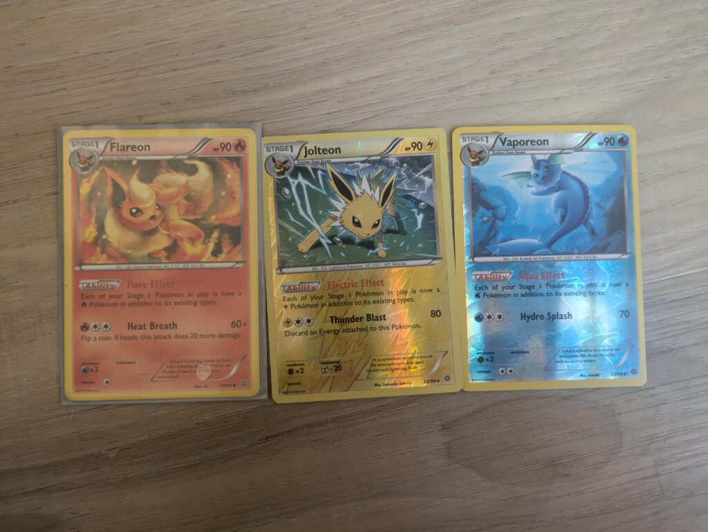 Thinking about making an Eeveeloution deck (I know that's not recommended but just for funzies) Theoretically, what if I had all 3 of these in play. Would each pokemon become Fire, Electric, Water, and whatever it's original type is?