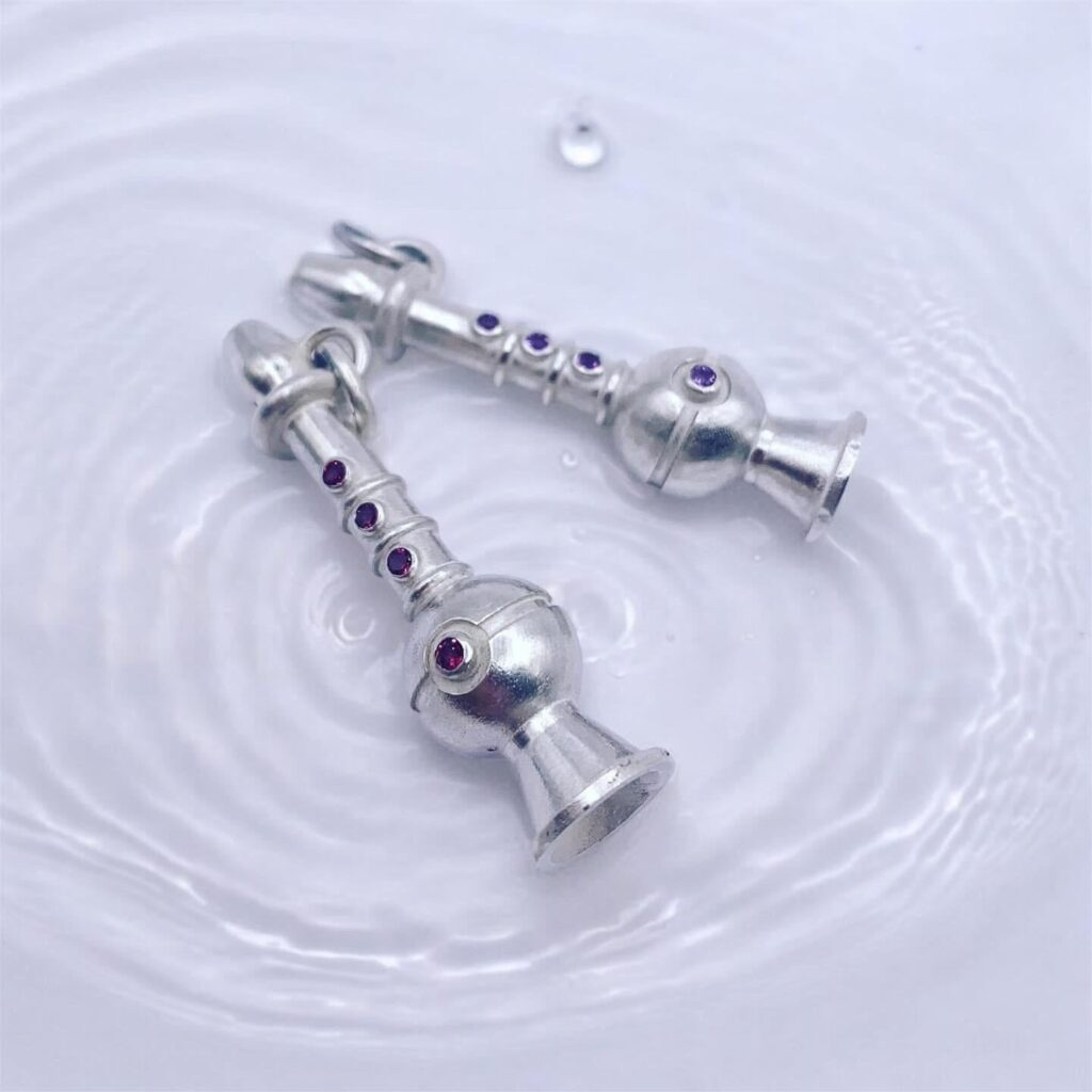 Some sterling silver poke flute pendants I made with natural stones.