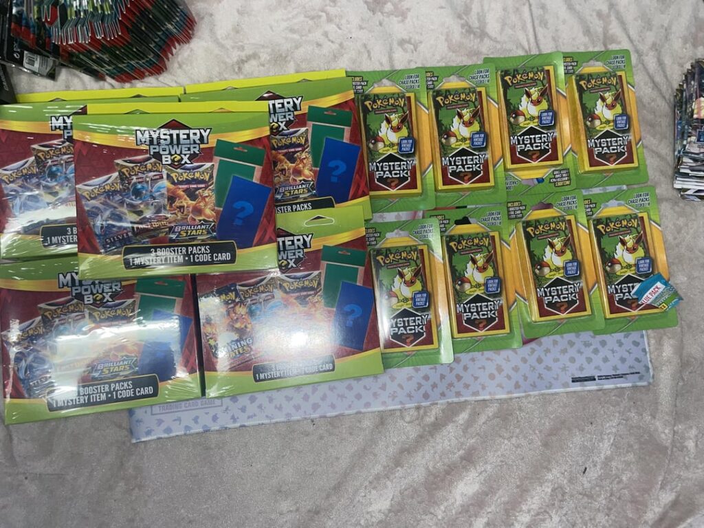 Decent for mystery box sets had a Dragonite tin and some random packs on 2nd slide . Pulls last