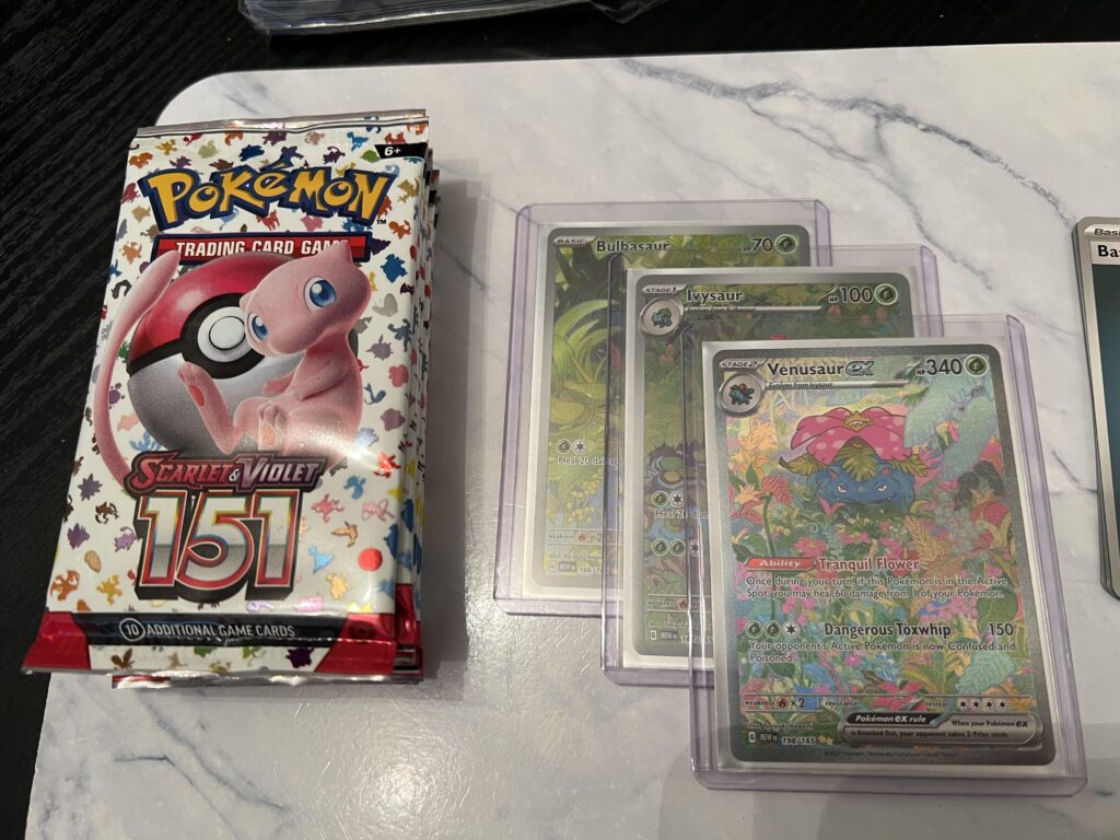 Grabbed a 151 ETB from Costco and somehow managed to get a Demigod pack on the first pack…