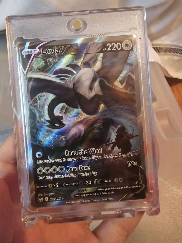Opened my first tin and I got a Lugia!! Sell? Grade? Keep?