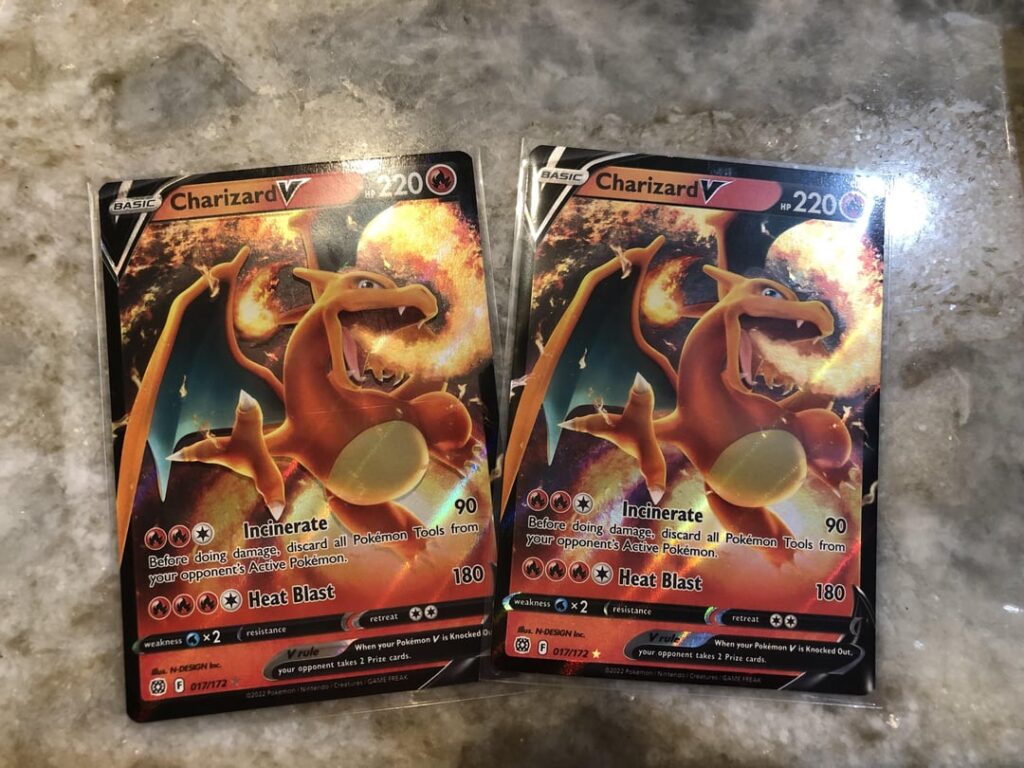Can anyone tell me more about why the left charizard has a drop shadow and the right one does not?