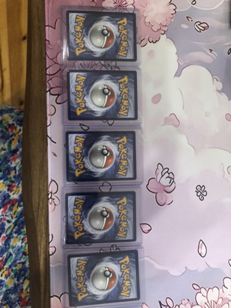 Dashed line across back of 5 reverse holos