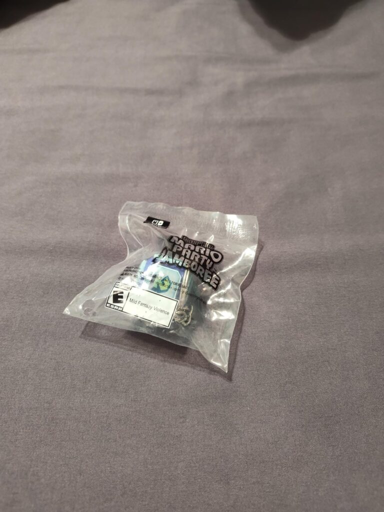 Dice Block keychain I got from GameStop preorder of Super Mario Party Jamboree