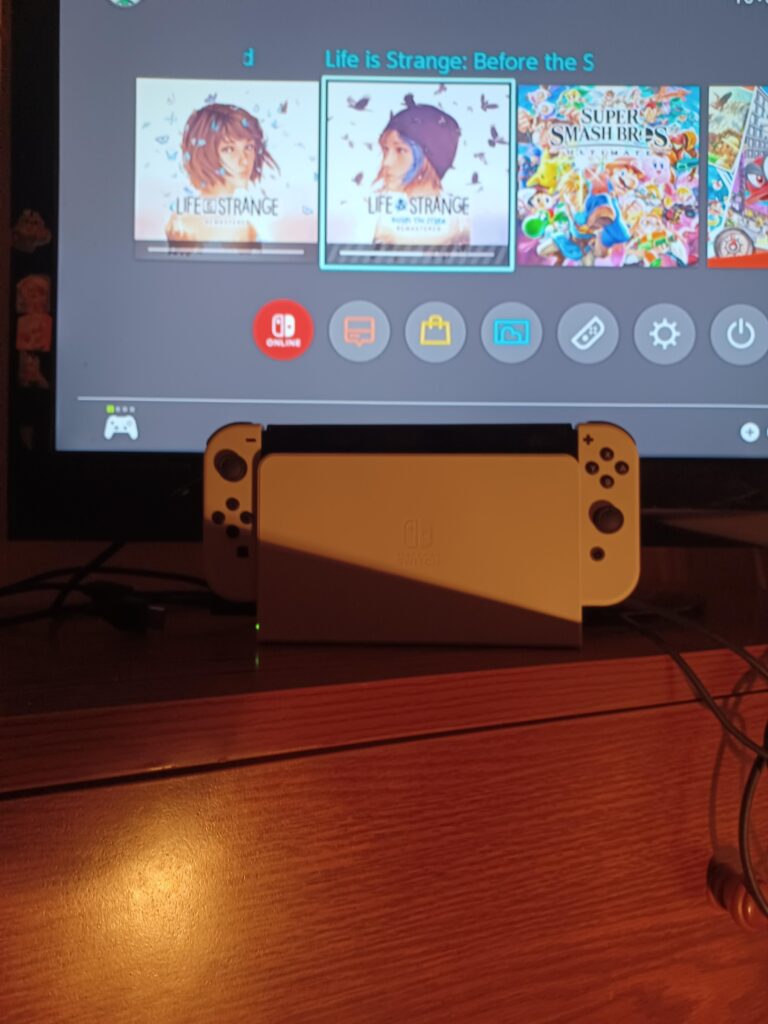 Not the best picture but I was given a Nintendo Switch Oled as Christmas present any tips/games I should know about? First time owning a nintendo switch