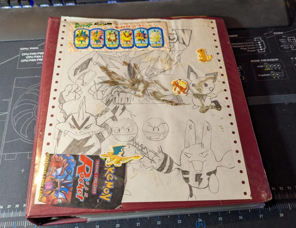 I bought this empty binder years ago from a card shop because of the art the previous owner put in it. Just didn't feel right letting it be thrown away, so I kept it to take care of it. Hope the kid that drew it/made it is doing great and kept on drawing!