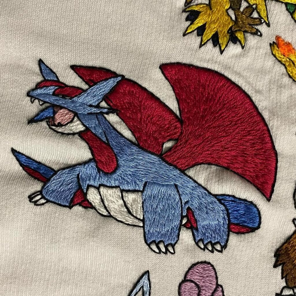 My latest additions to my hand embroidered Pokemon Sweater!