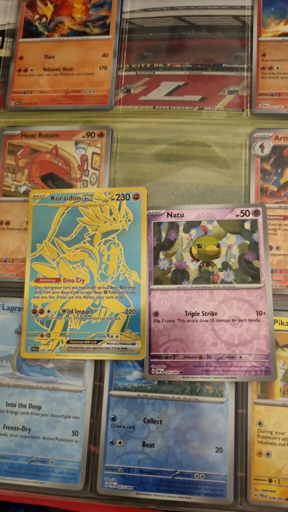 I was sorting my Paldean Fates pulls into my childhood binder and two cards were stuck together. Turns out Natu was hiding my first ever gold card pull