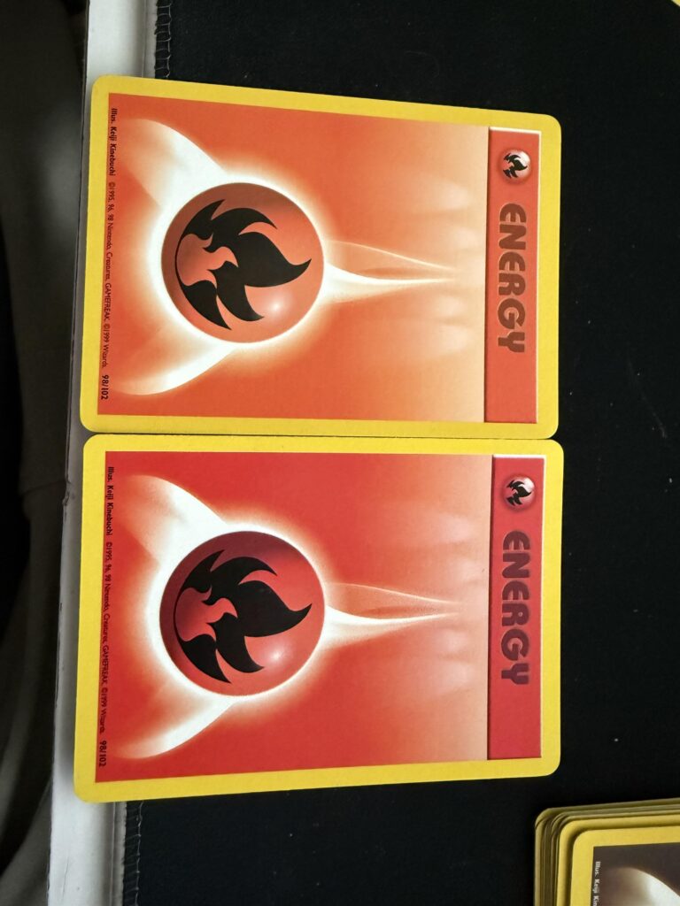 Two base set fire energy both unlimited…. Different color of red.