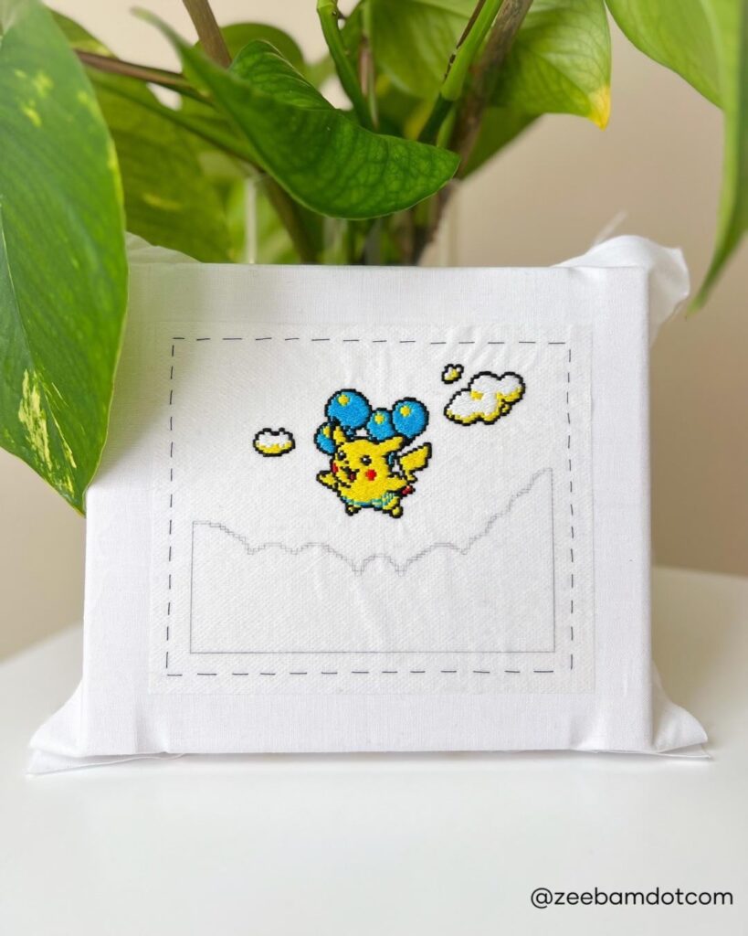 [OC] Finished the tiny clouds on this hand embroidered Pikachu and I’m so happy with how the pixelated style is turning out!