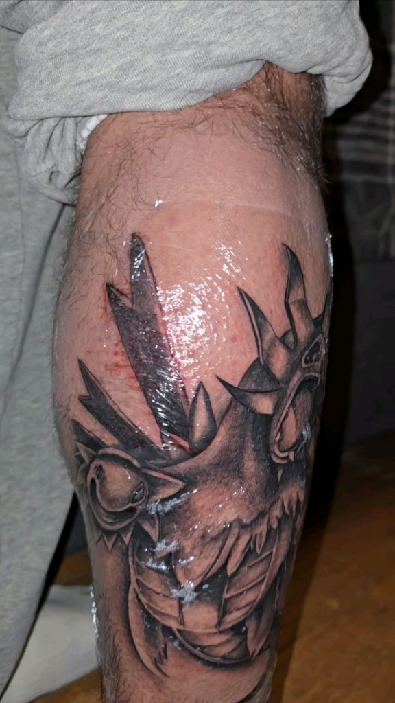 Tattoo on my calf of my favorite pokemon