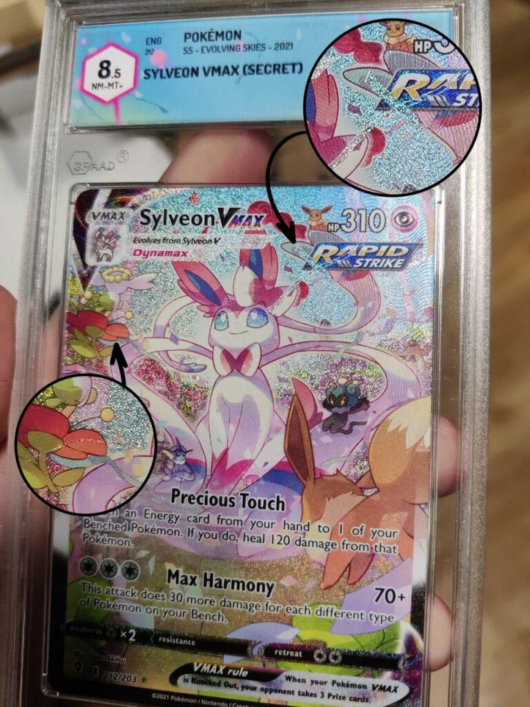 Is it misprint or just scratched? The card is graded 8.5 from GRAAD but no info. It has a "cross" X near "Rapid Strike", where the surface is still normally flat and holo. Please help and explain your point of view if it's a defect made by grading or previews owner, or it's a factory misprint.