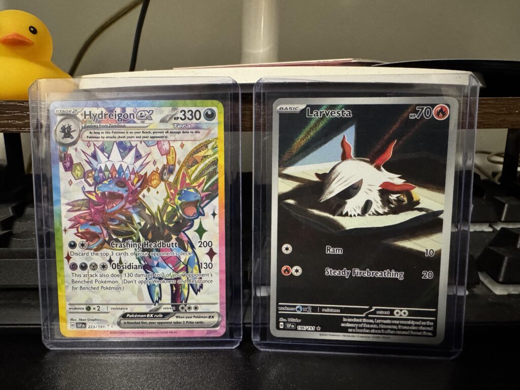 Best pulls from my surging sparks booster bundle, the Larvesta reminds me of my cat 😂