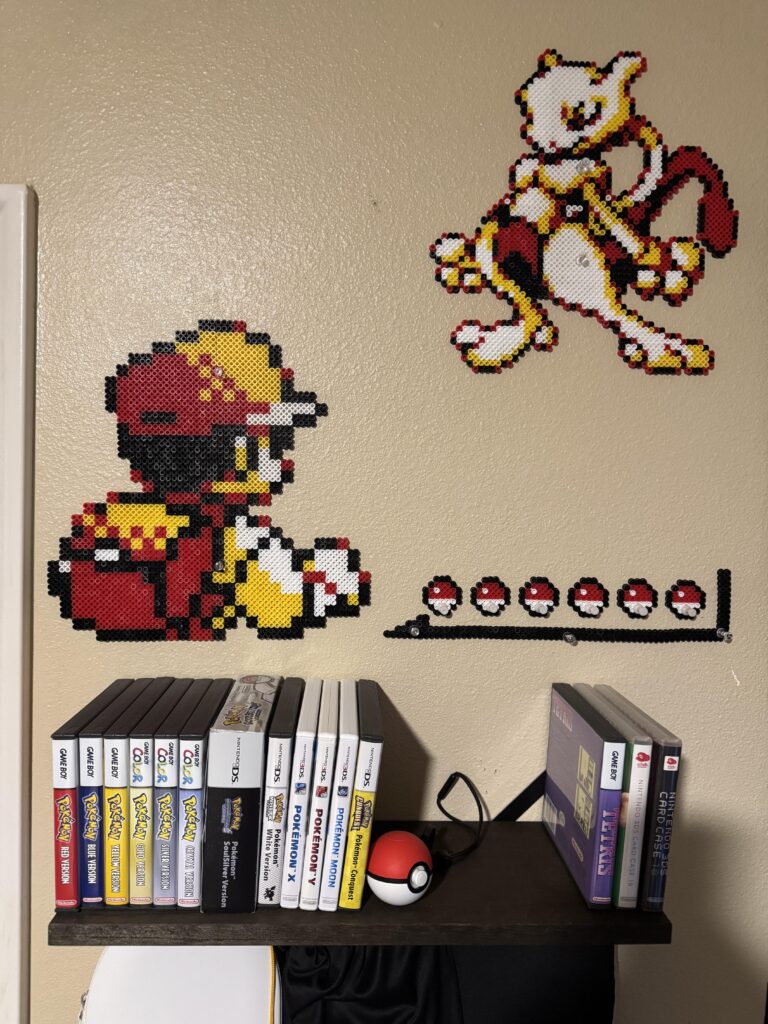 Finished my decorations for the Pokemon Games Shelf
