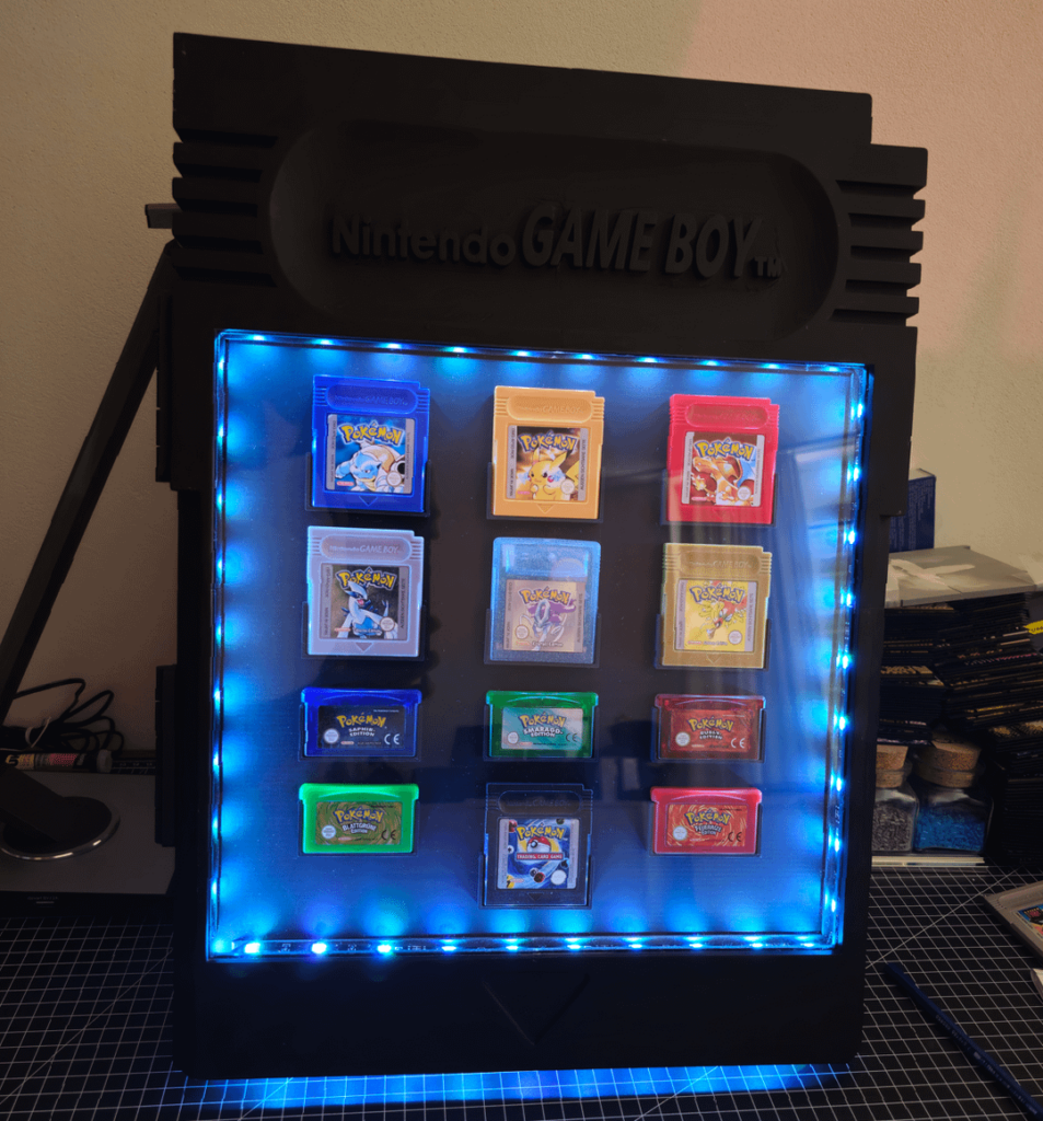 Couldn't find a cool way to showcase my Pokemon Game Boy collection, so I designed & 3D printed my own custom display frame (OC)