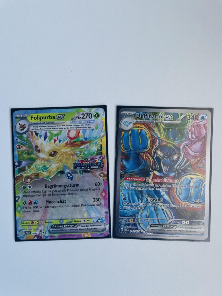 My pulls from a Prismatic Evolutions surprise box. That Palafin Artwork is amazing.