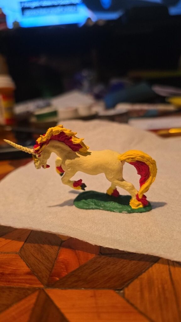 Painted a mini unicorn as Rapidash for DnD!