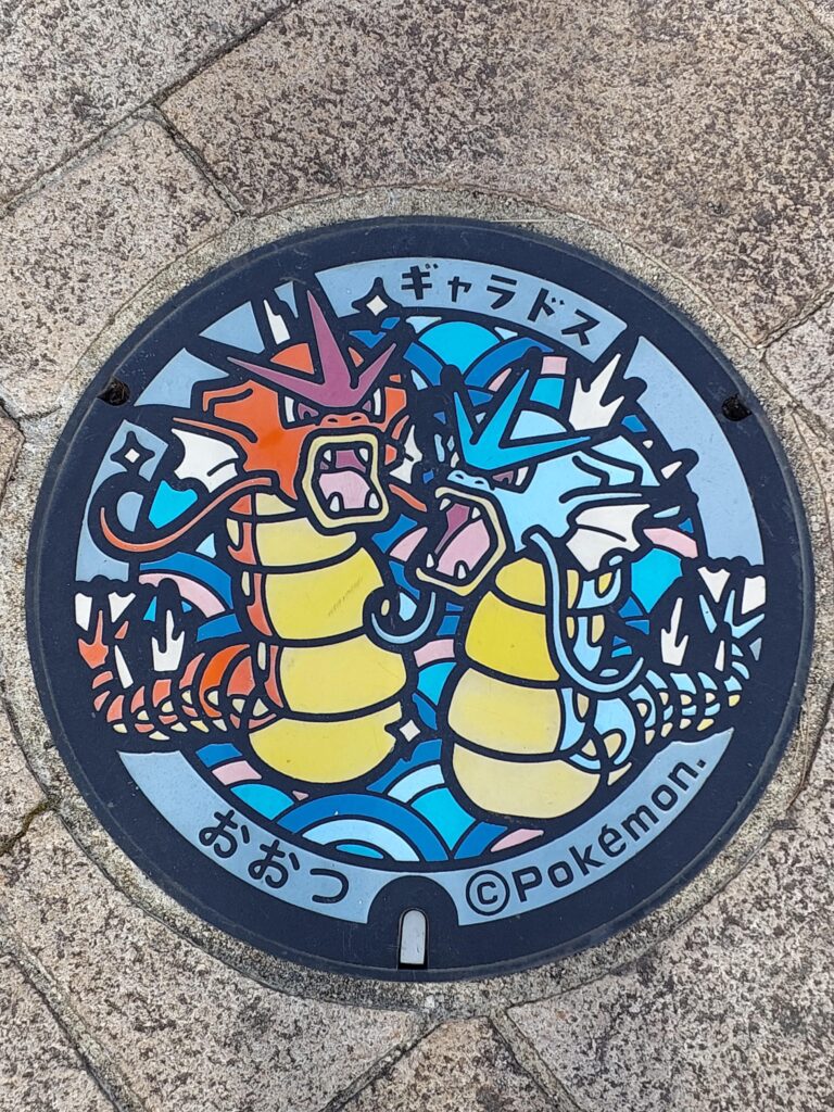 Pokemon manhole at the shore of Lake Biwa, the real-life location of Lake of Rage