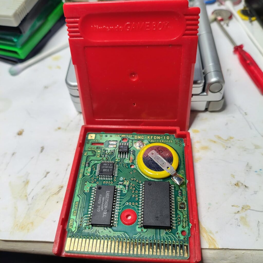 Fixed this Pokémon red after reflowing the pins and cleaning the contacts Mind the work station 😂