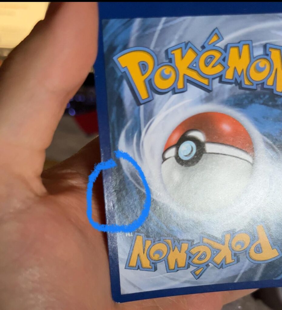 Bought a card considered NM, but it has a small dents at the back