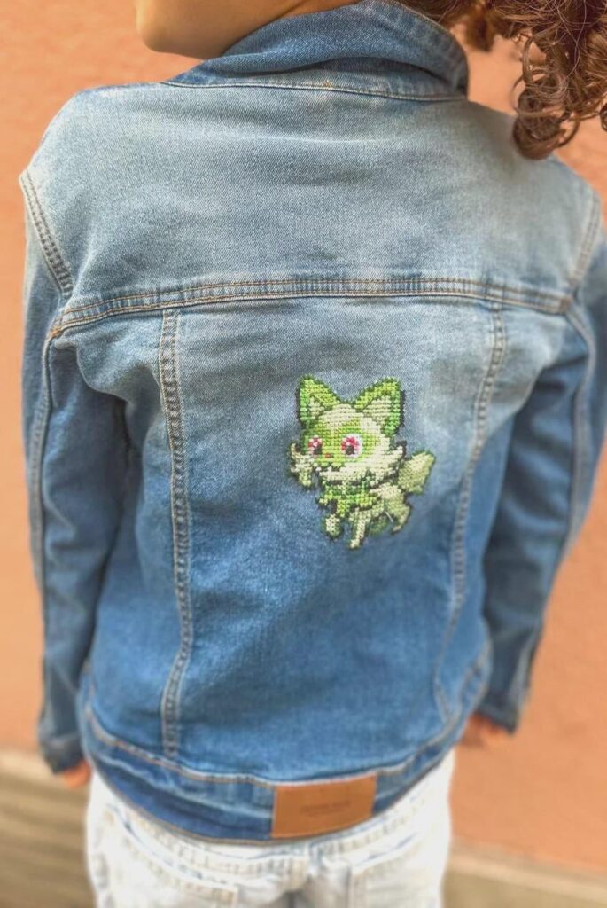 Sprigatito on a denim jacket