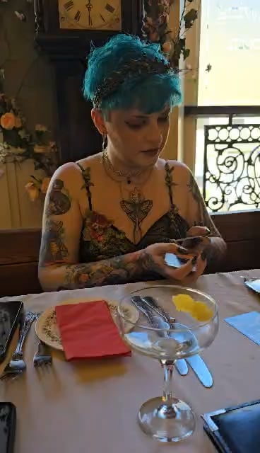 My wife on our wedding day, at the reception dinner, pulling the exact card they were hunting for