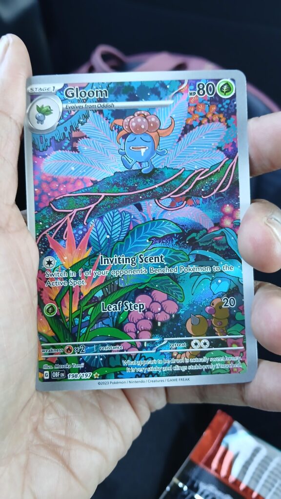 Went on a fruitless restock hunt and ended up getting the obsidian flames packs nobody wanted. Pulled this little cutie