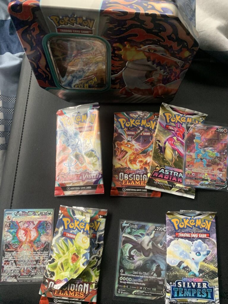 Somehow got a god tin… (3 chase cards in 3 packs)