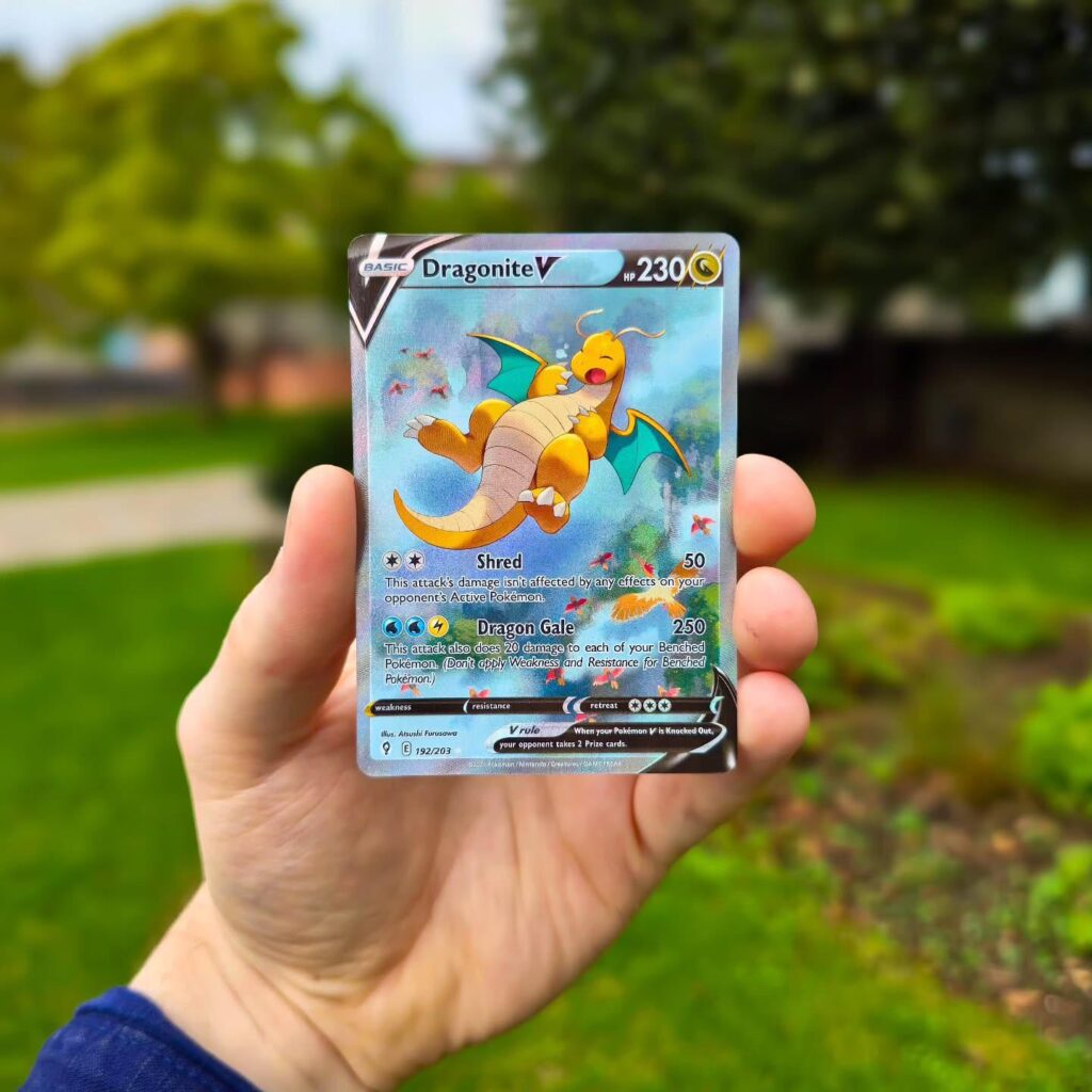Check out this awesome Dragonite V card I just pulled! The artwork is so vibrant, and it's definitely a great addition to my collection. What do you think of it? Have you had any lucky pulls lately?