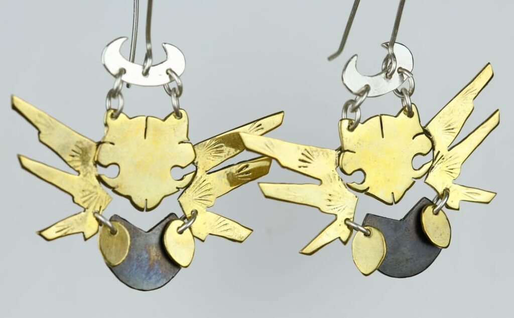 I handmade a pair of Shedinja dangle earrings. I can finally show off my favorite pokemon c:
