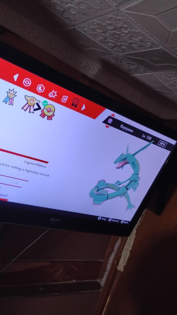 My original 2004-2005 Rayquaza which has the legend ribbon from heartgold (2009)