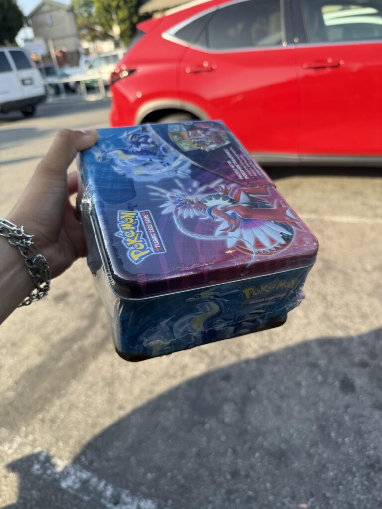 Bought a Paldea Evovled Tin from the Pokémon Machine and it was soaked in water