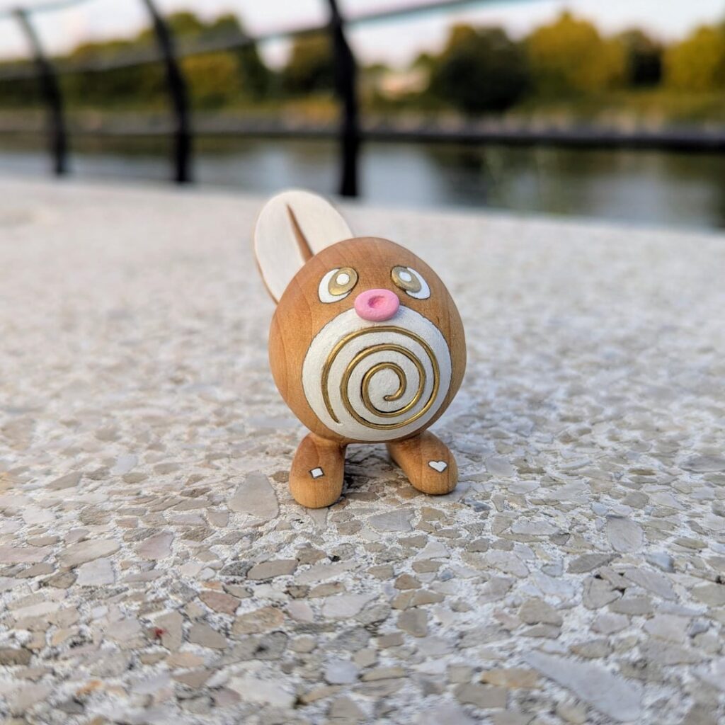I carved a Poliwag out of maple wood with custom brass inlays! [OC]