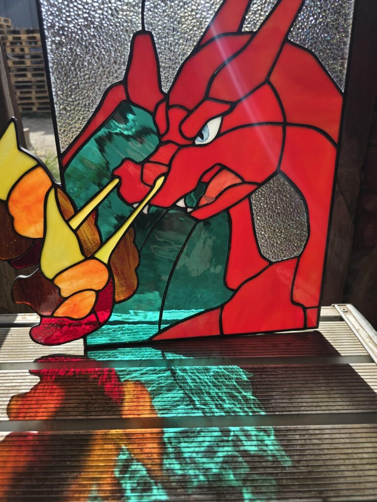 My GF just up and made a Charizard...out of stained glass... in our house....i hope you are all as amazed as i am cause im not even sure what to do with myself.