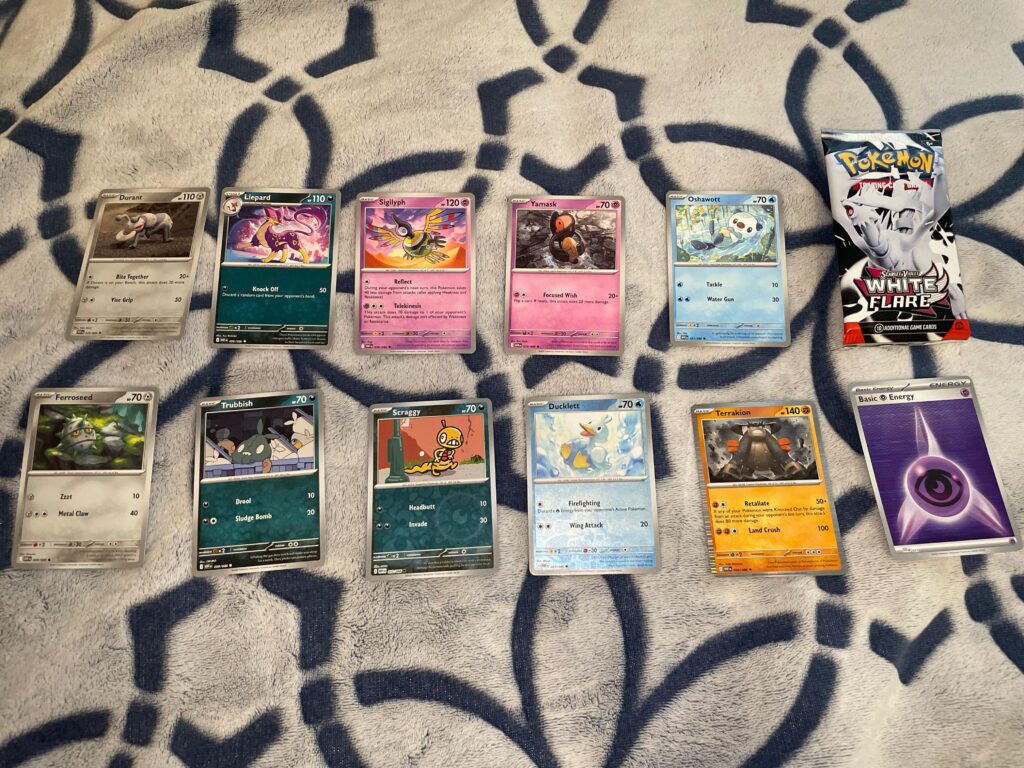 11 cards, two reverse holos, and one holo in white flare pack