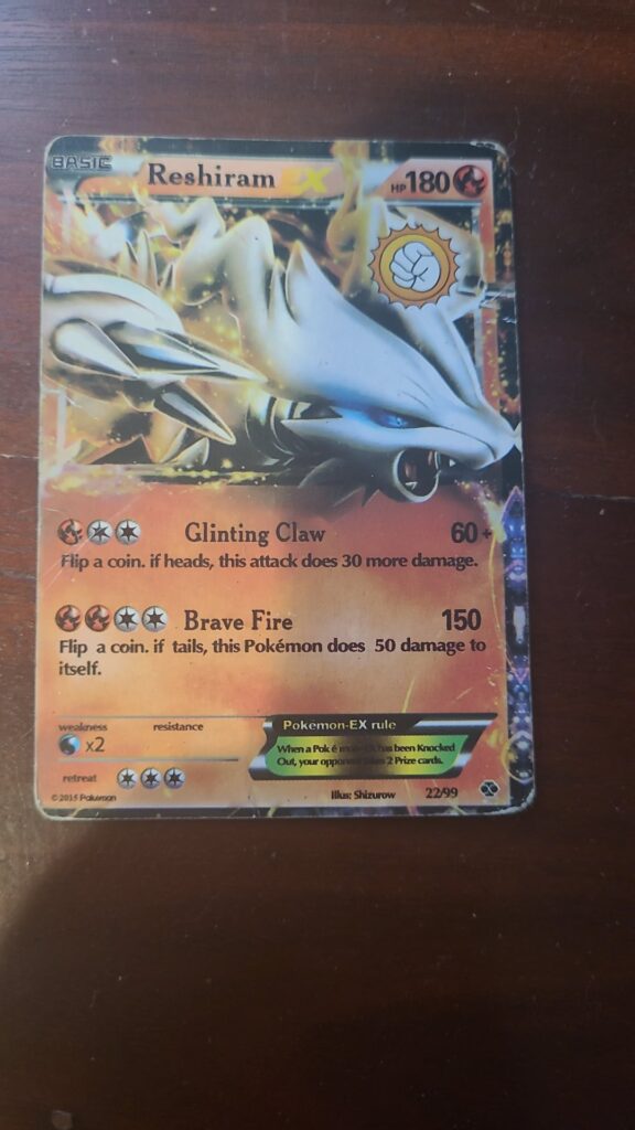Weird sticker or stamp on Reshiram Pokemon Card