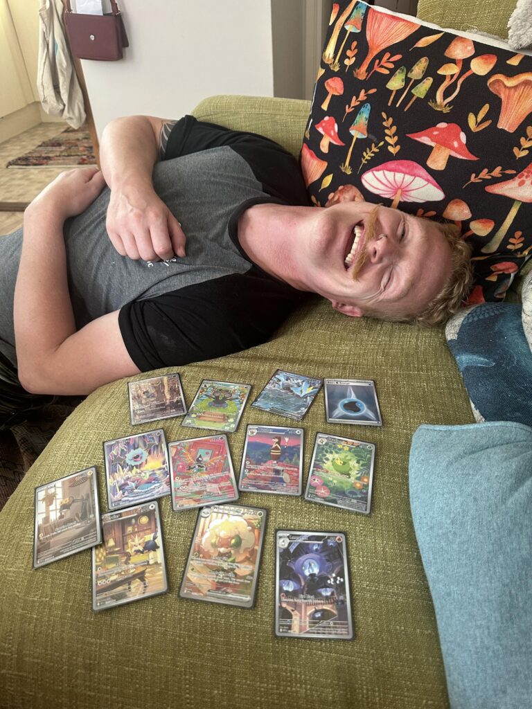 I bought my boyfriend a tin on my way home from work and he pulled a god pack! LOOK AT HIS HAPPY FACE