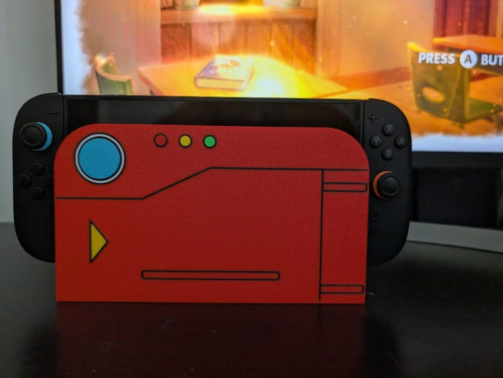 As a huge Pokemon fan I love how this turned out. Designed and 3D printed a Pokedex Switch 2 dock faceplate cover.