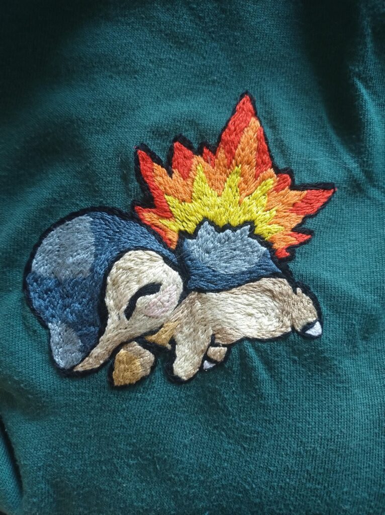 Hand embroidered Cyndaquil on sweater