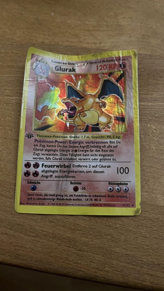 My brother found this absolutely wrecked 1st edition Glurak in the car he bought a year ago 💀💀