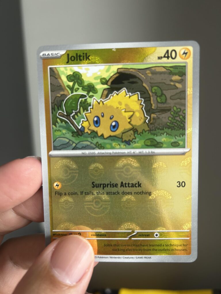Is this considered a missprint or damaged? On the top right at the center it has a small speck or overlay of a border beneath the pokeball print.