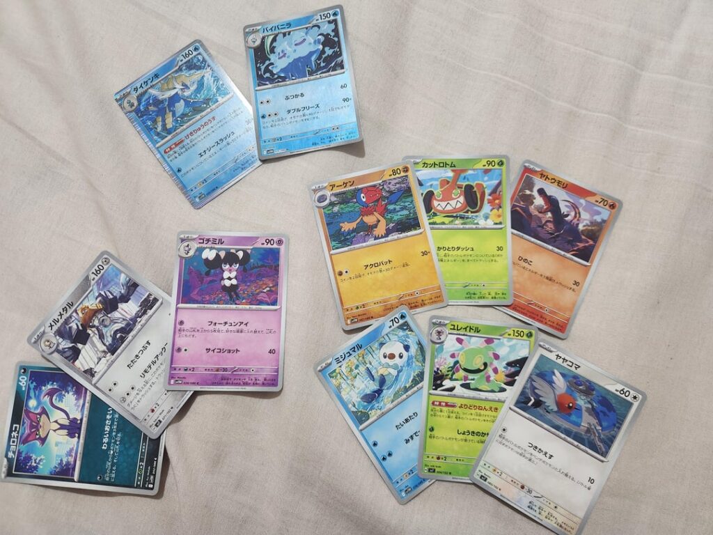 Bought my first ever packs today, the holographic ones at the top are quite pretty